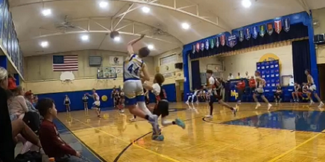 Milton Pope's Cooper Thorson is seen Tuesday night attempting a full-court buzzer beater shot.