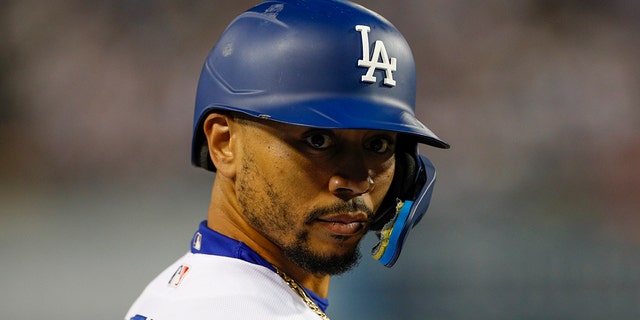 Los Angeles Dodgers right fielder Mookie Betts, #50, looks on during the NLDS Game 2 between the San Diego Padres and the Los Angeles Dodgers on Oct. 12, 2022 at Dodger Stadium in Los Angeles.