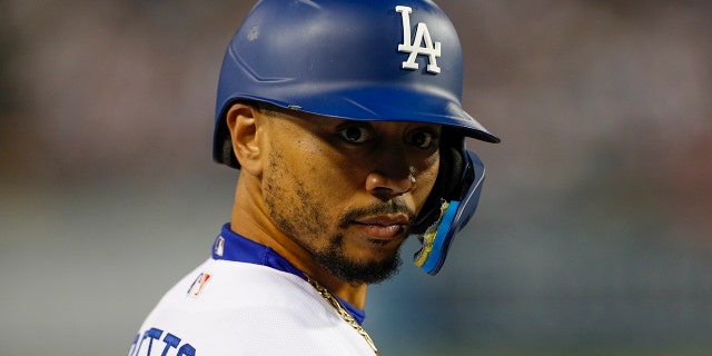 Los Angeles Dodgers right fielder Mookie Betts, #50, looks on during the NLDS Game 2 between the San Diego Padres and the Los Angeles Dodgers on Oct. 12, 2022 at Dodger Stadium in Los Angeles.