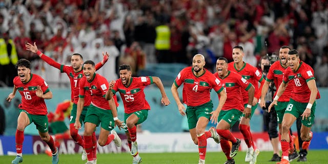 Morocco's players celebrate after the penalty shootout during their World Cup match against Spain, at the Education City Stadium in Al Rayyan, Qatar, on Dec. 6, 2022.
