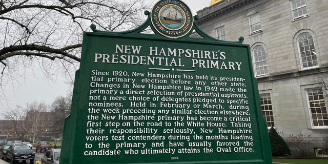 A sign marking New Hampshire's cherished century-old tradition of holding the nation's first presidential primary stands across the street from the state Capitol in Concord, N.H., Dec. 7, 2022.