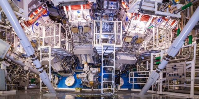 FILE - This undated image provided by the National Ignition Facility at the Lawrence Livermore National Laboratory shows the NIF Target Bay in Livermore, Calif. The system uses 192 laser beams converging at the center of this giant sphere to make a tiny hydrogen fuel pellet implode. 