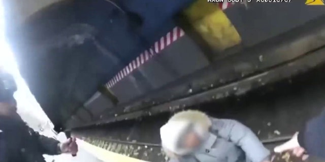 NYPD officers raced to rescue a man who had fallen onto the subway tracks at a Brooklyn station early Saturday.