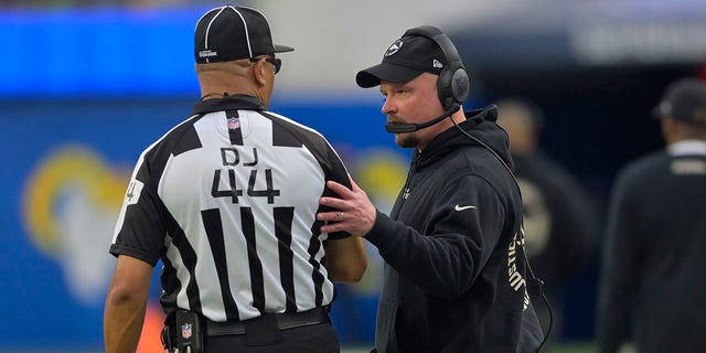 Denver Broncos head coach Nathaniel Hackett talks to the referee Ron Torbert during the first half of the game against the Denver Broncos at SoFi Stadium on Dec. 25, 2022 in Inglewood, California.