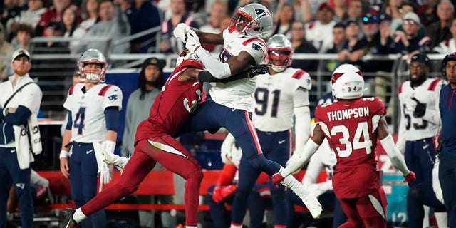 Arizona Cardinals cornerback Christian Matthew, #35, breaks up a pass intended for New England Patriots wide receiver Nelson Agholor, #15, during the second half of an NFL football game, Monday, Dec. 12, 2022, in Glendale, Arizona.