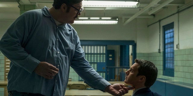 Cameron Britton, left, as Ed Kemper in the Netflix true-crime series "Mindhunter."