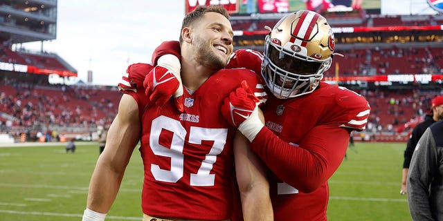 San Francisco 49ers defensive end Nick Bosa, #97, celebrates with offensive tackle Trent Williams after the 49ers defeated the New Orleans Saints in an NFL football game in Santa Clara, California, Sunday, Nov. 27, 2022. 