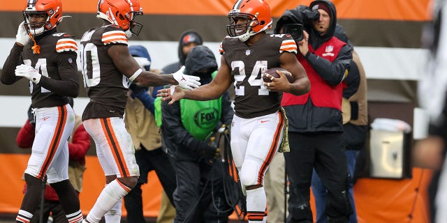 Cleveland Browns running back Nick Chubb (24) is congratulated by wide receiver Jarvis Landry (80) after scoring a touchdown during the second quarter of a game against the Detroit Lions Nov. 21, 2021, at FirstEnergy Stadium in Cleveland.