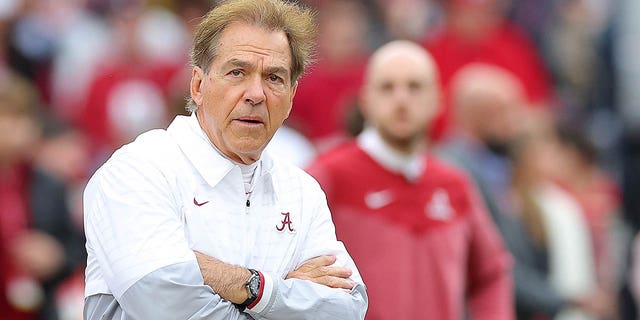 Nick Saban looks at the field