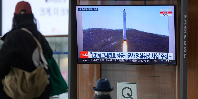 A television screen shows a picture of North Korea's rocket with test satellite during a news program at Seoul Railway Station in Seoul, South Korea on Saturday, Dec. 31, 2022. The North fired another missile a few hours earlier of South Korean and Japanese leaders were due to meet on Thursday. 