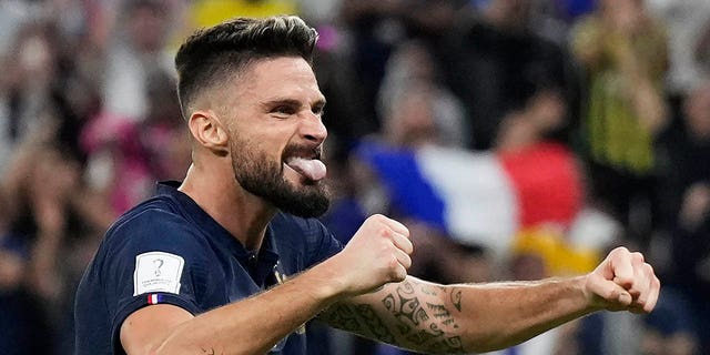 France's Olivier Giroud celebrates after Kylian Mbappe scored their side's second goal during the World Cup match against Poland, at the Al Thumama Stadium in Doha, Qatar, Sunday, Dec. 4, 2022.