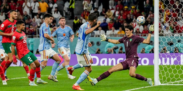 Spain's Pablo Sarabia tries a shot during the World Cup Round of 16 soccer match between Morocco and Spain, at the Education City Stadium in Al Rayyan, Qatar, Tuesday, Dec. 6, 2022.