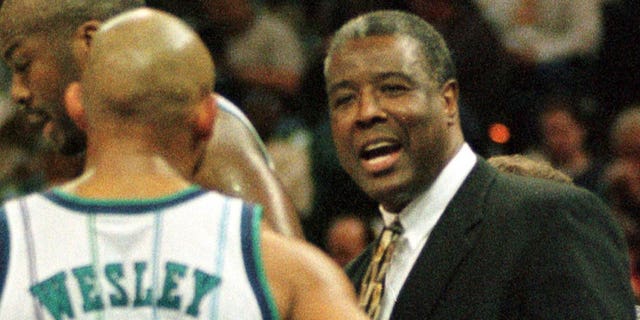 Charlotte Hornets new head coach Paul Silas speaks to David Wesley during a time-out March 9 during his debut at the Charlotte Coliseum. Silas was an assistant coach under Dave Cowens, who resigned March 7.