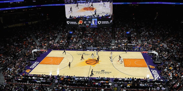 General view of action as Chris Paul #3 of the Phoenix Suns moves the ball upcourt during the second half of the NBA game at Footprint Center on October 19, 2022 in Phoenix, Arizona.