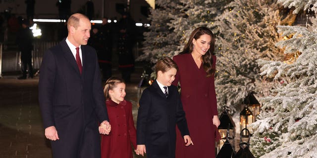 Prince William, Prince of Wales; Princess Charlotte of Wales; Prince George of Wales; and Catherine, Princess of Wales, attend the 