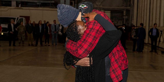 Brittney Griner hugs her wife Cherelle after release from a Russian jail.