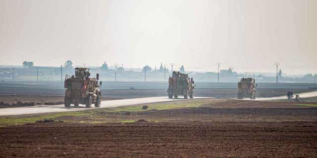 US military vehicles on a patrol in the countryside near Qamishli, Syria, on Dec. 4, 2022. U.S. and Kurdish-led forces arrested an Islamic State group militant in eastern Syria. 