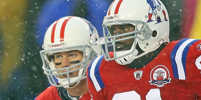 New England Patriots quarterback Tom Brady and wide receiver Randy Moss ran off the field after Moss' 1st TD catch on the play of the game in the 2nd quarter during the Pats 59-0 victory at Gillette Stadium on Sunday, Oct. 18, 2009.