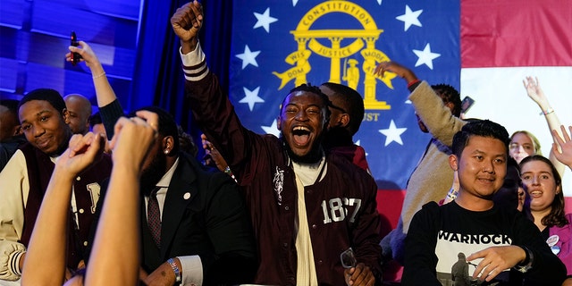 Supporters cheer during an election night watch party for Democratic Sen. Raphael Warnock, Tuesday, Dec. 6, 2022, in Atlanta. Sen. Warnock defeated Republican challenger Herschel Walker in a runoff election in Georgia.