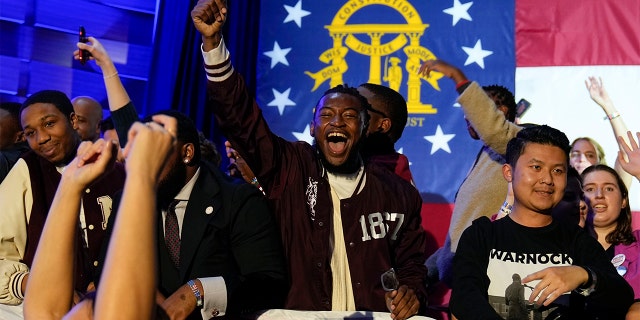 Supporters cheer during an election night watch party for Democratic Sen. Raphael Warnock, Tuesday, Dec. 6, 2022, in Atlanta. Sen. Warnock defeated Republican challenger Herschel Walker in a runoff election in Georgia.