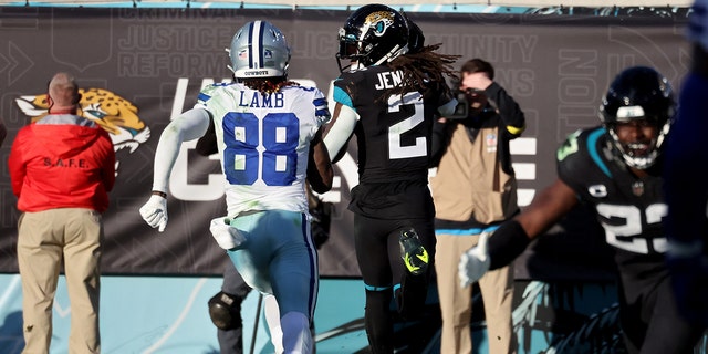 Rayshawn Jenkins (2) of the Jacksonville Jaguars returns a pick-six in overtime to defeat the Dallas Cowboys at TIAA Bank Field on Dec. 18, 2022, in Jacksonville, Florida.