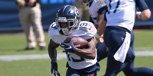 September 20, 2020;  Nashville, Tennessee, United States;  Tennessee Titans wide receiver Cameron Batson (13) runs with the ball at Nissan Stadium.