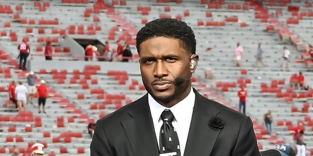 Rob Stone, Reggie Bush,and Matt Leinart of the Fox Big Noon Kickoff show discuss the game between the Nebraska Cornhuskers and the Oklahoma Sooners at Memorial Stadium on September 17, 2022 in Lincoln, Nebraska.