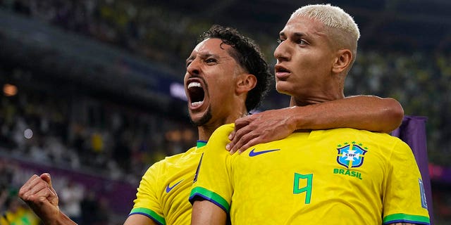 Brazil's Richarlison, right, celebrates after scoring his side's third goal with teammate Marquinhos during the World Cup Round of 16 match against South Korea, at the Education City Stadium in Al Rayyan, Qatar, Monday, Dec. 5, 2022.