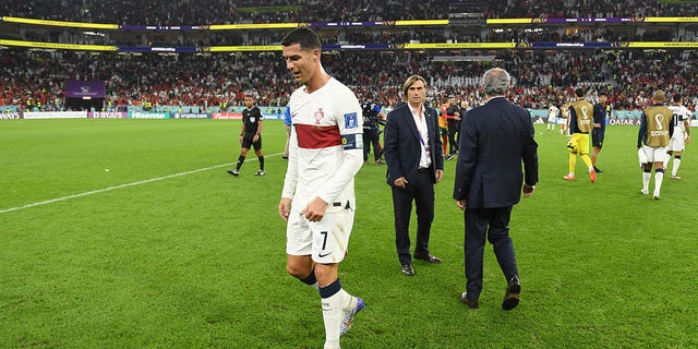 Cristiano Ronaldo of Portugal walks off the pitch after the 0-1 loss during the FIFA World Cup Qatar 2022 quarter final match between Morocco and Portugal at Al Thumama Stadium on December 10, 2022 in Doha, Qatar.