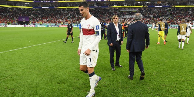 Cristiano Ronaldo of Portugal walks off the pitch after the 0-1 loss during the FIFA World Cup Qatar 2022 quarter final match between Morocco and Portugal at Al Thumama Stadium on December 10, 2022 in Doha, Qatar.