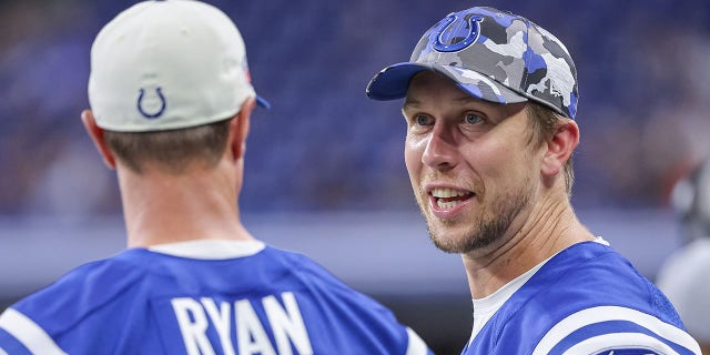 Matt Ryan and Nick Foles of the Colts on the sideline during the preseason game against the Tampa Bay Buccaneers at Lucas Oil Stadium on Aug. 27, 2022, in Indianapolis.