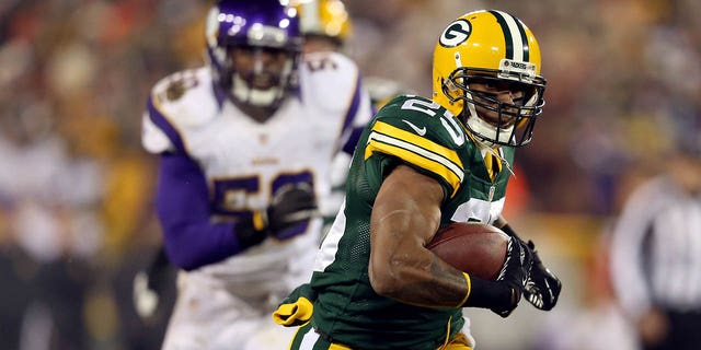 Running back Ryan Grant of the Packers runs the ball against the Minnesota Vikings during the NFC wild card playoff game at Lambeau Field on Jan. 5, 2013, in Green Bay, Wisconsin.