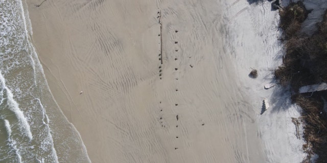 The debris was discovered a couple of weeks ago after part of the beach was washed away following Hurricane Nicole.