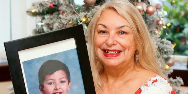 Glasgow, Scotland, mother Joyce Curtis with a photo of her son Nicholas who was recently found in France.  
