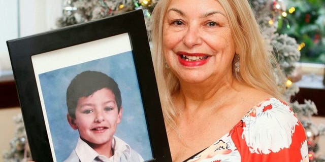 Glasgow, Scotland, mother Joyce Curtis with a photo of her son Nicholas who was recently found in France.