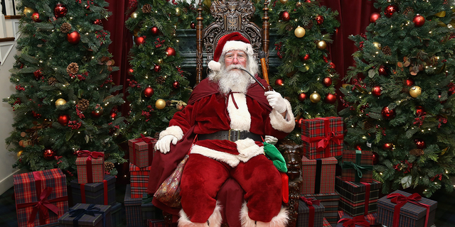 Santa Claus attends an evening hosted by Brooks Brothers to celebrate the holiday with St. Jude Children's Research Hospital at Brooks Brothers in New York City.