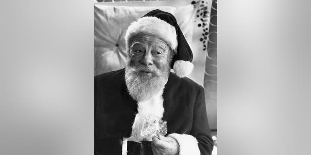 Kris Kringle (Edmund Gwenn) gives out candy to the kids at Macy's, where he plays Santa Claus in "Miracle On 34th Street," a 20th Century Fox production. Gwenn, like entrepreneur James Edgar, is a charter member of the International Santa Hall of Fame.