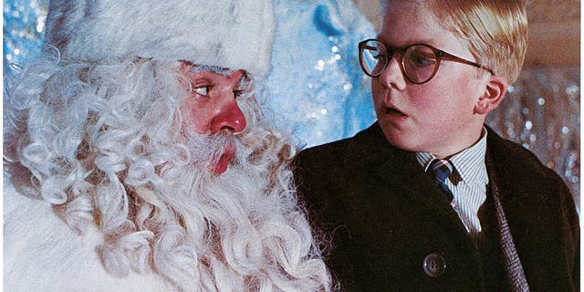 Peter Billingsley sits on Santa's lap in a scene from the film "A Christmas Story," 1983.