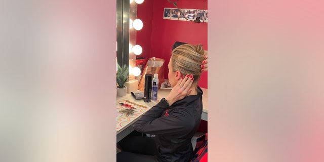Grooms Hoge spends time getting ready in the Rockettes' dressing room before each performance. 