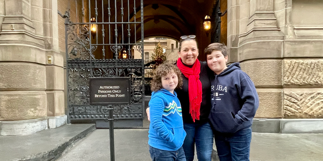 The entrance to The Dakota in Manhattan, where John Lennon was murdered in 1980. It's a global pilgrimage site today. "This place radiates significance," Ethan Doyle, proper, 12, of Philadelphia, informed Fox Information Digital on Dec. 7, 2022, the eve of the anniversary of Lennon's loss of life. He is pictured with brother Brodie and mother Monique Doyle.