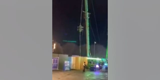 UK teens wait to be rescued after the Slingshot Ride malfunctioned.