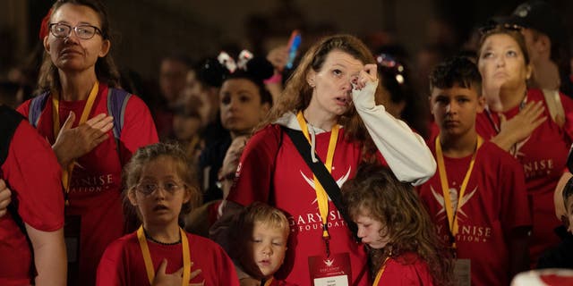 Family members mourn the fallen military heroes during the Walk of Gratitude event.