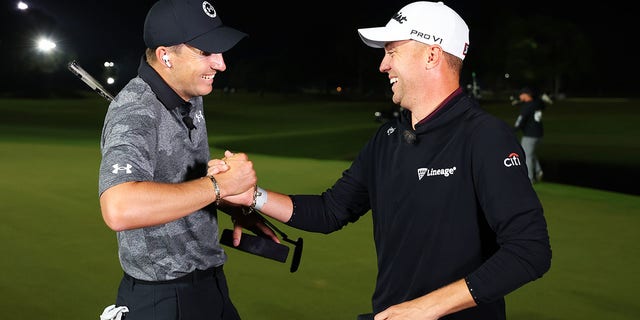 Jordan Spieth of the United States and Justin Thomas of the United States celebrate with their bracelets after defeating Tiger Woods of the United States and Rory McIlroy of Northern Ireland to win The Match 7 at Pelican Golf Club on December 10, 2022 in Belleair, Florida.