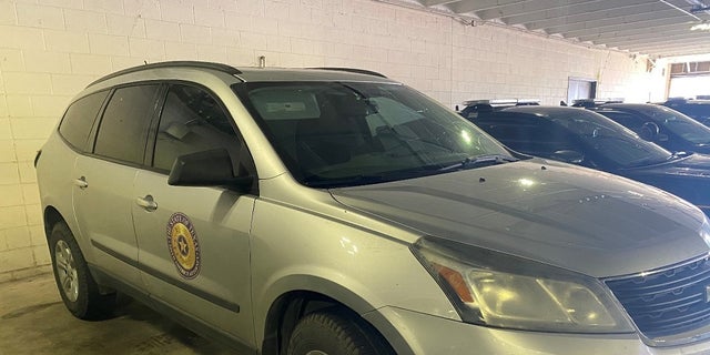 A 2015 Chevrolet Traverse with the emblem of the Starr County District Attorney’s Office in Texas. An employee of the office was fired after the car was sued in a human smuggling scheme, authorities said. 