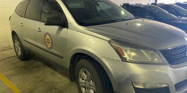 A 2015 Chevrolet Traverse with the emblem of the Starr County District Attorney’s Office in Texas. An employee of the office was fired after the car was sued in a human smuggling scheme, authorities said.