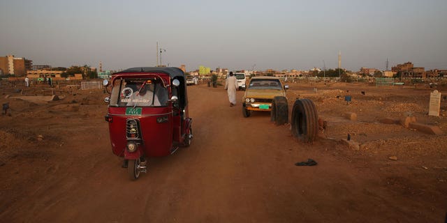 Cars drive along a road in Omdurman, Sudan, on July 15, 2017.