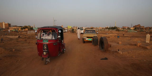 Cars drive along a road in Omdurman, Sudan, on July 15, 2017.