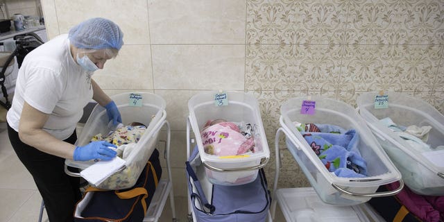 Newborn babies are seen inside their cribs in Kyiv, Ukraine, on March 17, 2022. Surrogate-born babies cannot reunite with their biological families due to ongoing Russian attacks in Ukraine.