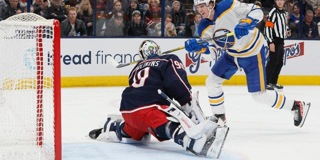 Buffalo Sabres' Tage Thompson, right, scores a goal against Columbus Blue Jackets' Elvis Merzlikins during the first period of an NHL hockey game Wednesday, Dec. 7, 2022, in Columbus, Ohio.