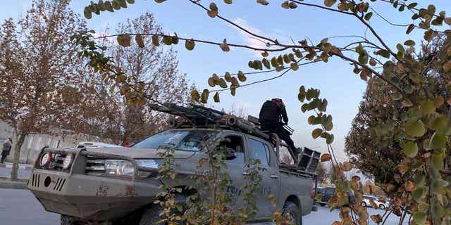Taliban fighters near the site of an attack in Kabul, Afghanistan, on Dec. 2, 2022. A prominent politician and warlord, Gulbuddin Hekmatyar, also escaped unhurt in a separate attack in Kabul on Friday, his office said in a statement. The two attackers were killed by security guards.